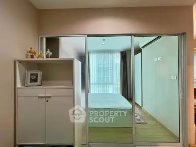 Modern bedroom with sliding glass doors and minimalist decor