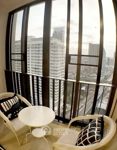 Chic urban balcony with stunning cityscape view, perfect for relaxation and enjoying the skyline.