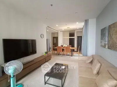 Spacious modern living room with elegant dining area and stylish decor
