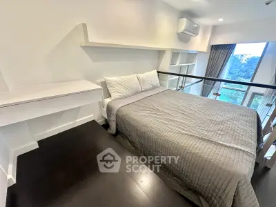 Modern bedroom with large window and built-in shelves, featuring a cozy bed and sleek design.