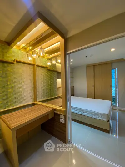 Modern bedroom with stylish wooden accents and geometric wallpaper, featuring a cozy bed and elegant lighting.