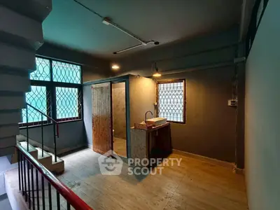 Spacious industrial-style interior with unique design elements and natural lighting.