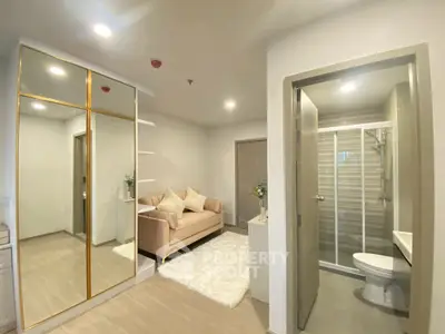 Modern apartment with cozy living area and stylish bathroom