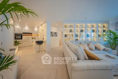 Luxurious open-plan living room with modern kitchen and elegant decor