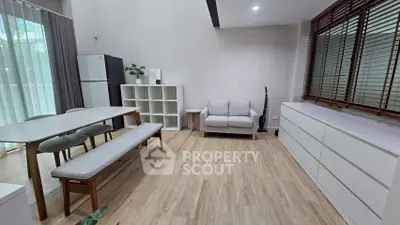 Modern living room with minimalist furniture and natural light