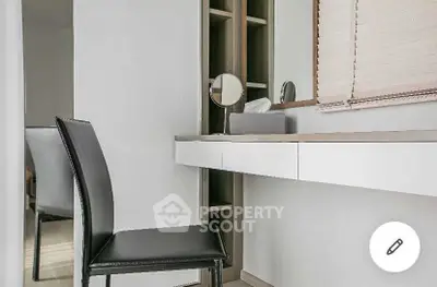 Modern study area with sleek chair and built-in desk, perfect for productivity.