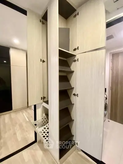 Modern storage cabinet with sleek design and ample shelving in a contemporary home interior.