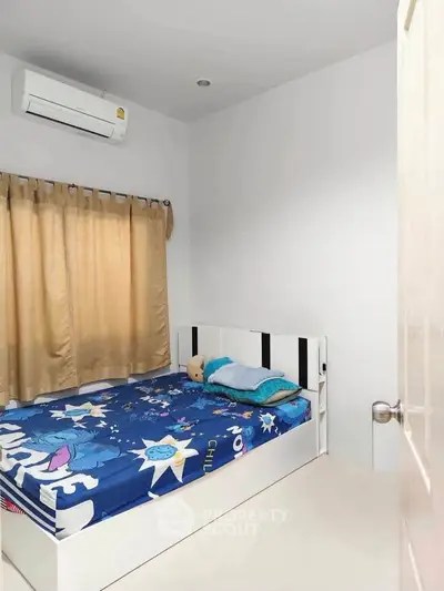 Cozy bedroom with air conditioning and stylish decor