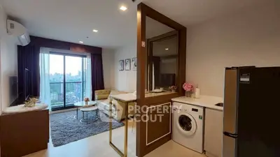 Modern living room with balcony view, washing machine, and stylish decor in a cozy apartment.