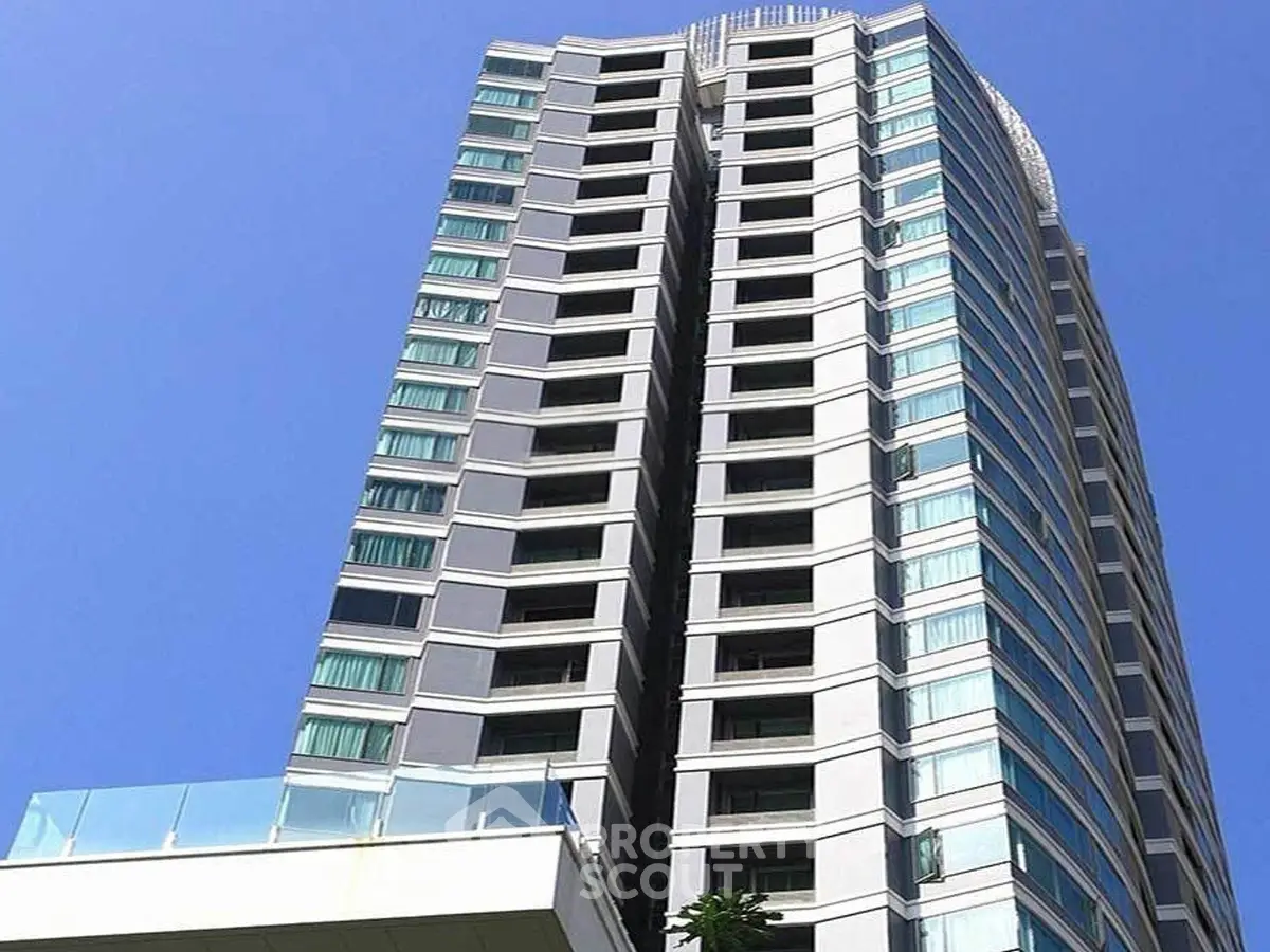 Stunning modern high-rise building with sleek architecture and expansive glass windows.