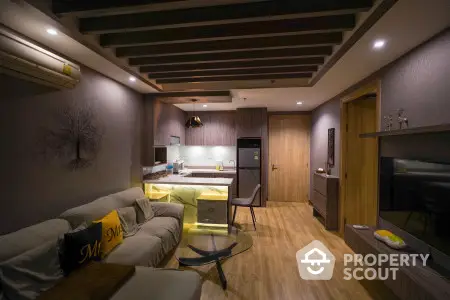 Cozy modern apartment interior with integrated living room and kitchen, featuring warm lighting, wooden accents, and contemporary furniture.