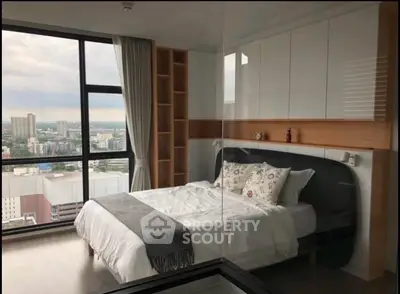 Modern bedroom with panoramic city view and stylish decor