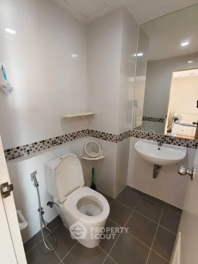 Modern bathroom with sleek fixtures and stylish tile accents, perfect for a contemporary home.