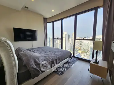 Luxurious bedroom with stunning city view and modern decor