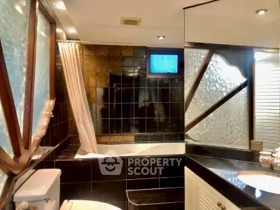 Luxurious bathroom with elegant black tiles and modern fixtures