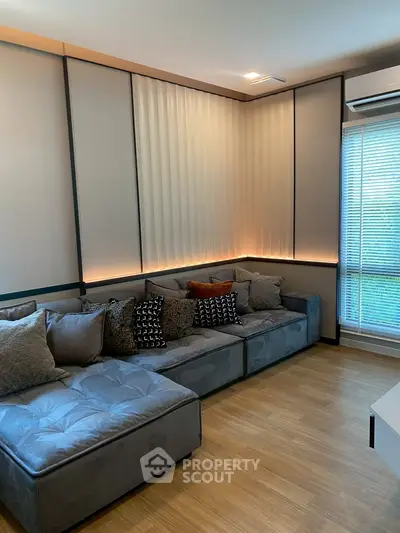 Stylish modern living room with cozy sectional sofa and ambient lighting