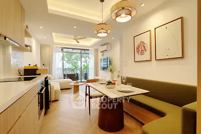 Modern open-plan living room with stylish decor and natural light