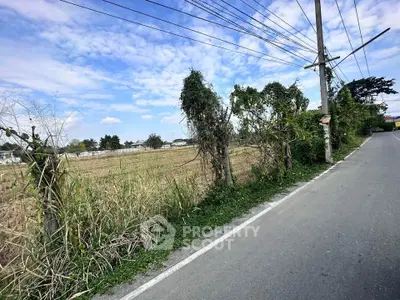 Expansive land plot with clear sky, ideal for development or investment opportunities.