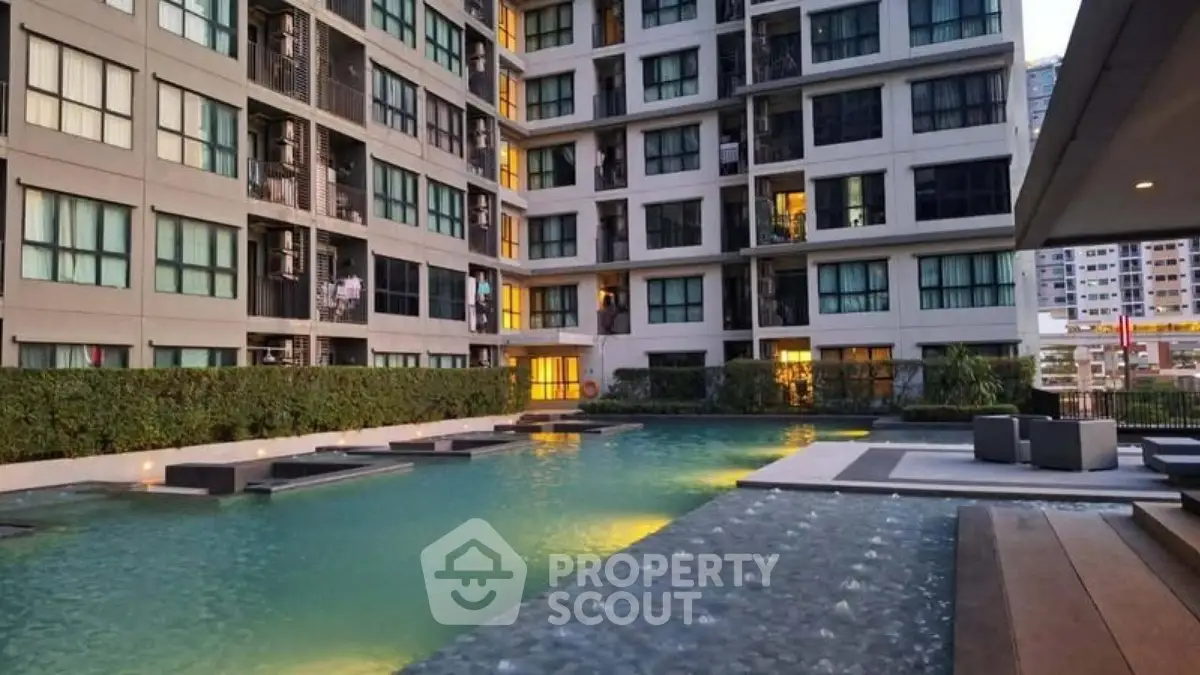 Luxurious apartment complex with stunning pool and modern architecture