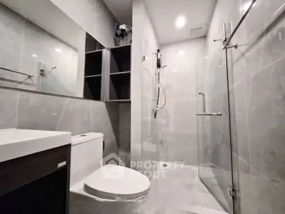 Modern bathroom with sleek glass shower and elegant fixtures