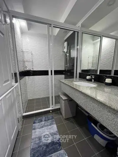 Modern bathroom with sleek design and glass shower enclosure