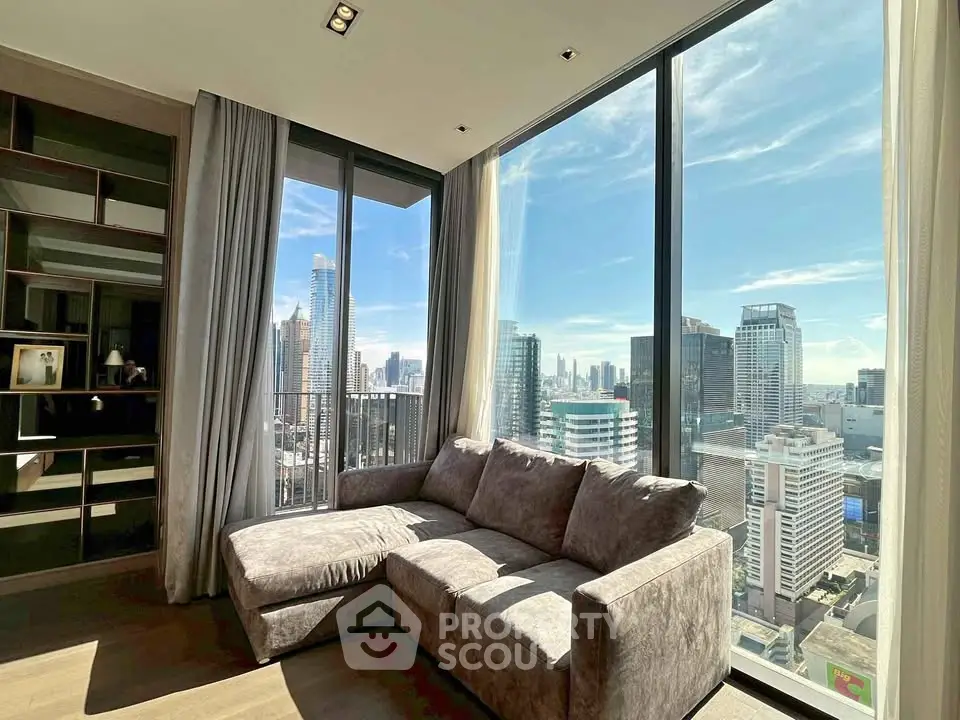 Luxurious living room with stunning city skyline view and modern furnishings.