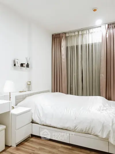Elegant bedroom with modern decor and soft lighting, featuring a cozy bed and stylish curtains.