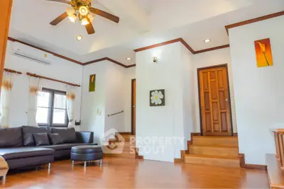 Spacious living room with modern decor and wooden flooring