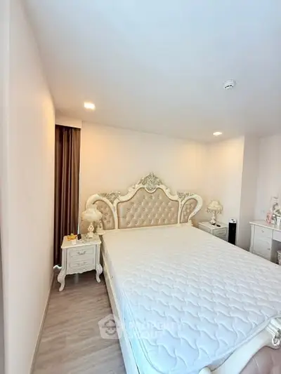 Luxurious bedroom with elegant decor and plush bed in modern apartment