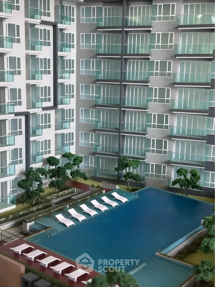 Luxurious condominium with modern pool and lush greenery, perfect for urban living.