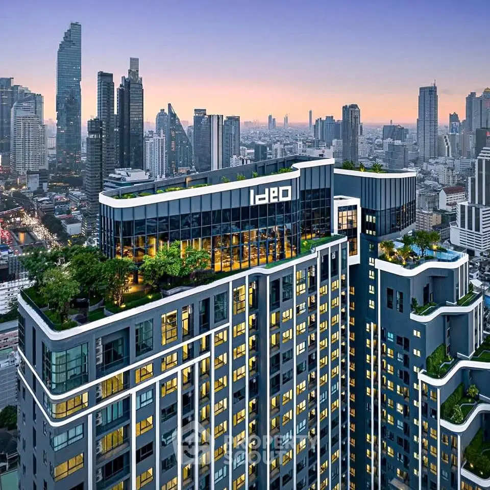 Stunning aerial view of modern high-rise building with lush rooftop garden in vibrant cityscape.