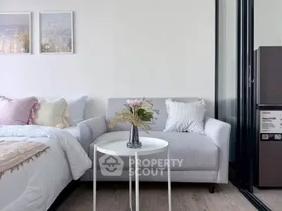 Modern bedroom with cozy sofa and stylish decor in a bright apartment