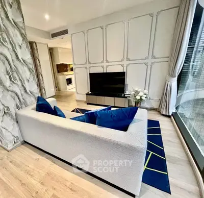 Modern living room with stylish decor and large window view