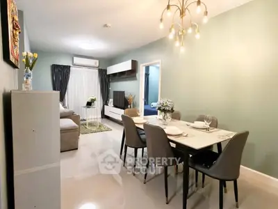 Elegant living and dining area with modern decor and stylish lighting