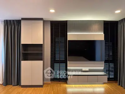 Modern living room with sleek TV unit and stylish cabinetry