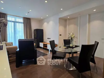 Modern living room with elegant dining area and stylish furniture in a contemporary apartment.