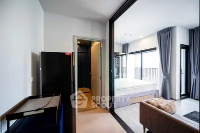 Modern apartment interior with open layout, featuring a cozy bedroom and stylish living area with large windows.