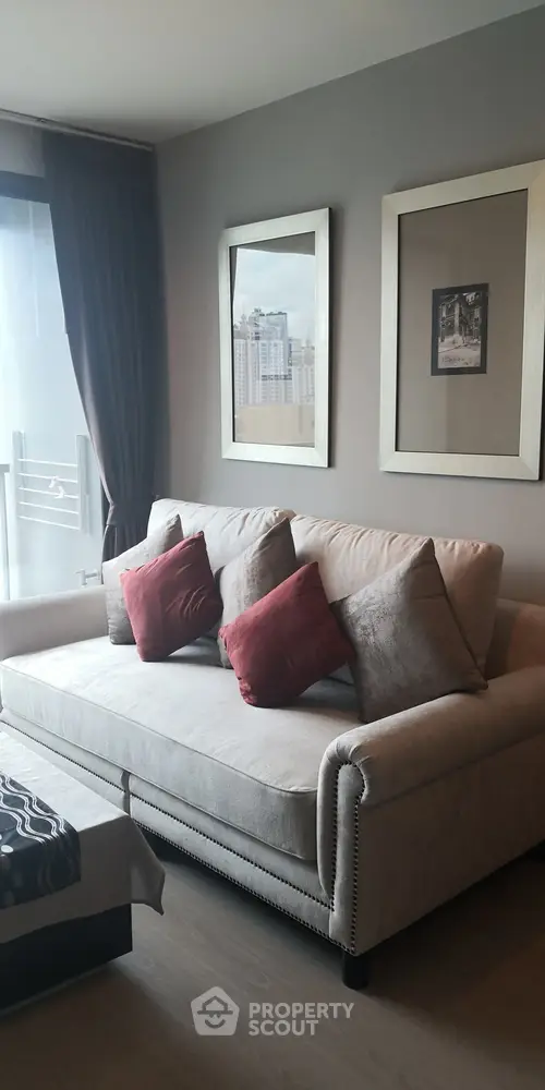 Modern living room with stylish sofa and city view window