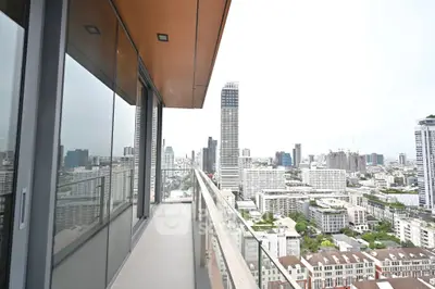 Stunning high-rise balcony with panoramic city views, perfect for urban living.