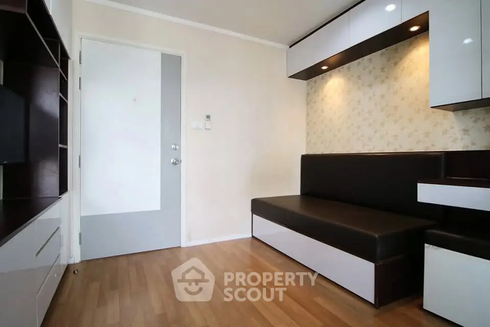 Modern living room with sleek built-in furniture and stylish lighting