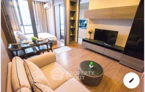 Modern living room with stylish furniture and open kitchen layout