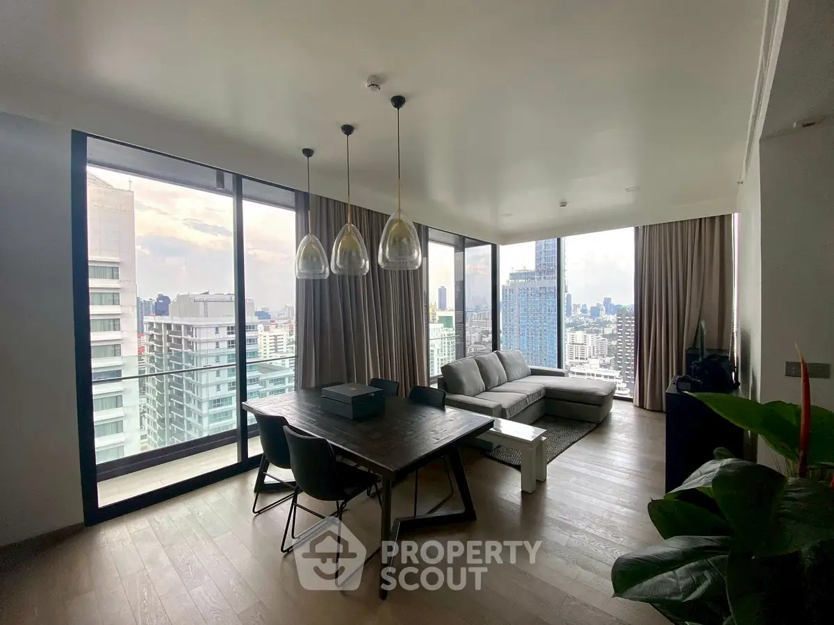 Stunning modern living room with panoramic city views and elegant furnishings.