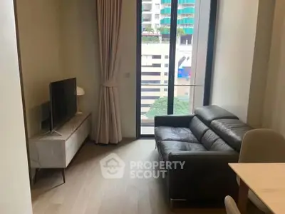 Modern living room with sleek leather sofa and large window view