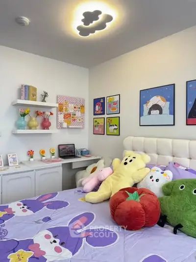 Charming bedroom with playful decor and plush toys, perfect for a cozy and inviting atmosphere.