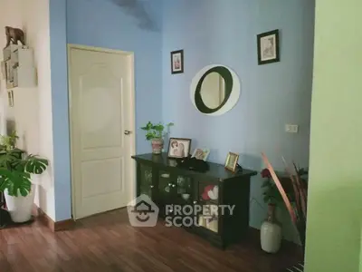 Charming interior hallway with stylish decor and wooden flooring