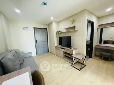 Modern living room with sleek furniture and wooden flooring