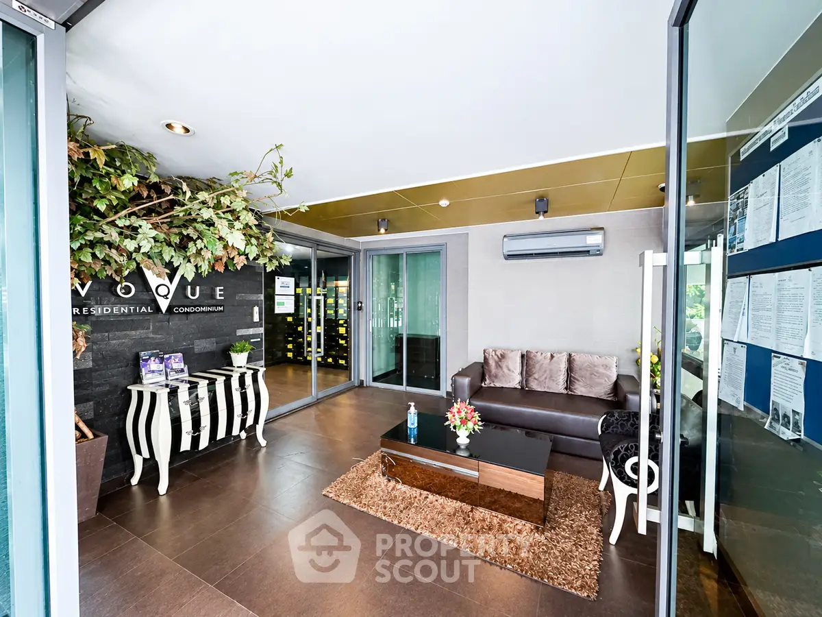 Stylish condominium lobby with modern decor and comfortable seating area.