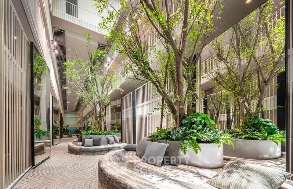 Luxurious modern building lobby with lush greenery and stylish seating