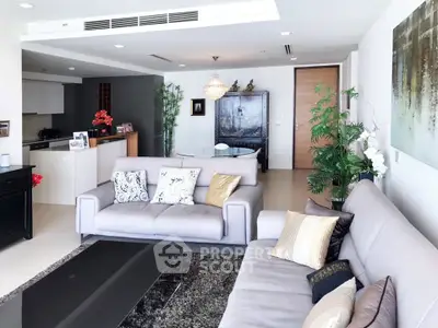 Luxurious modern living room with elegant decor and spacious seating area.