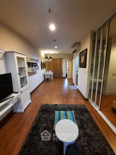 Spacious modern living room with wooden flooring and stylish decor